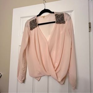 Dainty light pint blouse with embellished shoulders